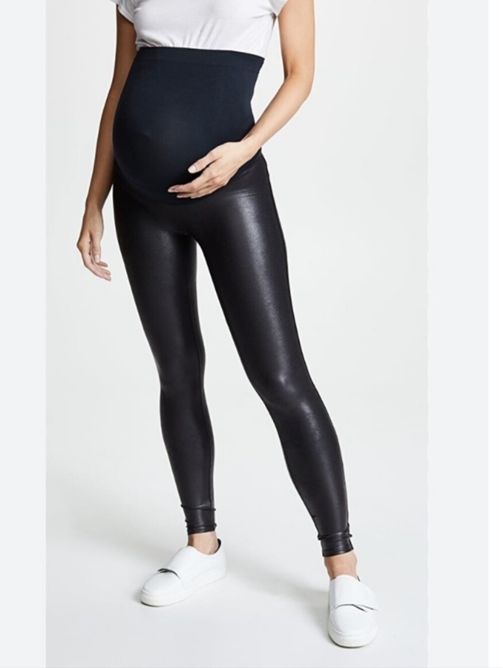 SPANX sleek black faux leather leggings with a high-rise stretch waistband